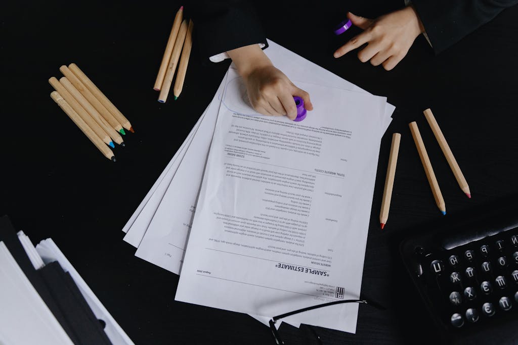 Hands Stamping Document