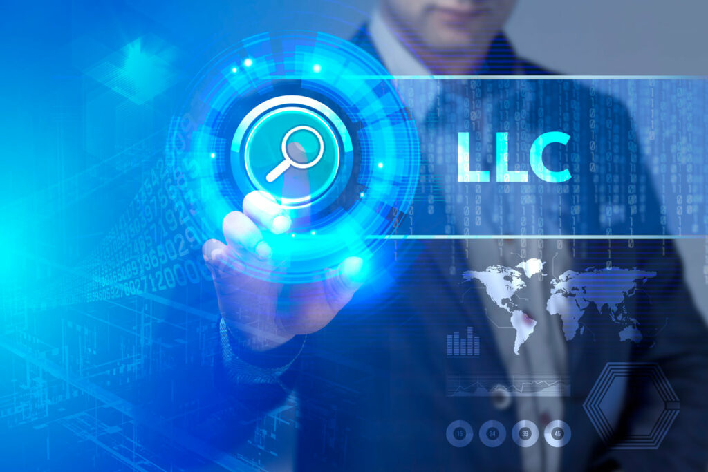 Business, Technology, Internet and network concept. Business man working on the tablet of the future, select on the virtual display: LLC