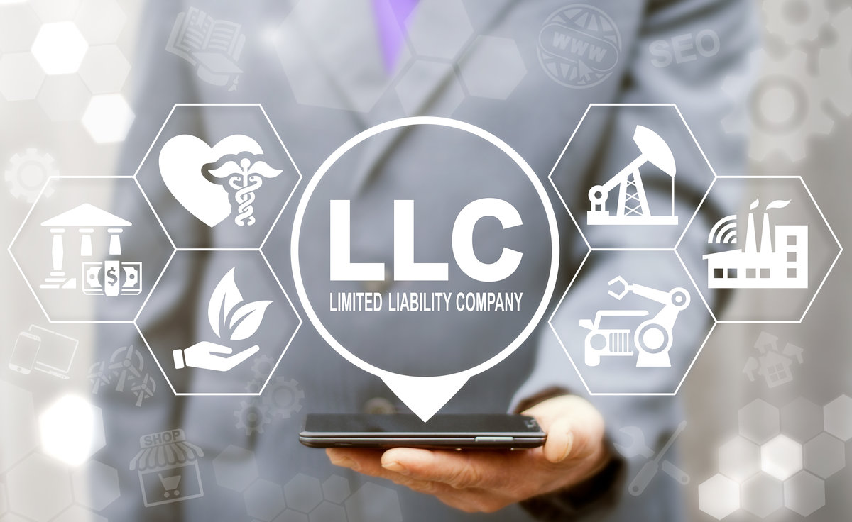 Limited Liability Company (LLC) Business Industry Healthcare concept. Man offers smartphone with limited liability company text icon on a virtual interface.
