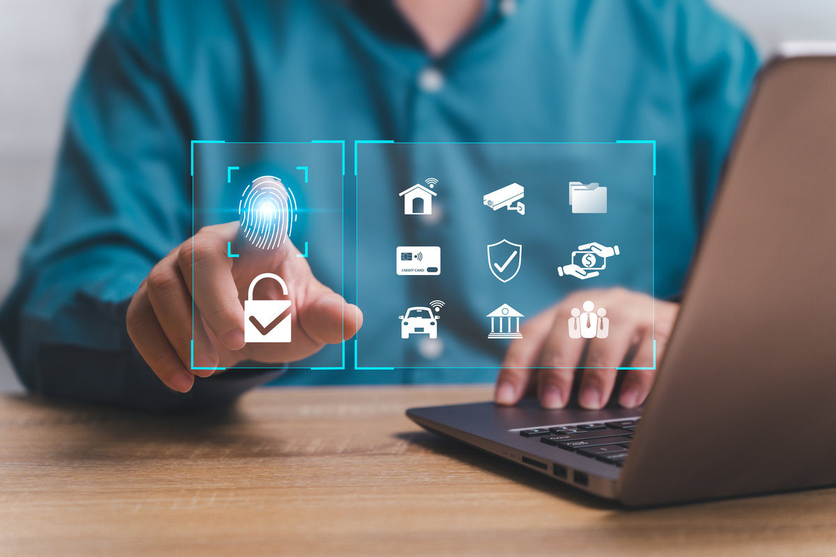Cybersecurity of Personal online security on Internet system concept Businessmen fingerprint on virtual screen and use laptop protection Personal data, Bank, Credit Card codes, home, car, IP camera