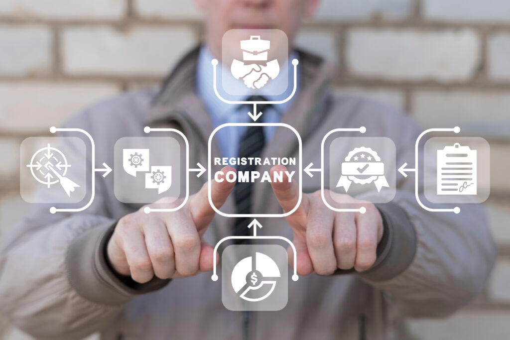 Man using virtual touch screen presses inscription: REGISTRATION COMPANY. New company registration concept. Business start up. Brand and identity building process. Company formation procedure.